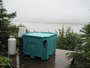 a fish tote transformed into a hot tub, you can't really tell but the glacier is directly across from this.